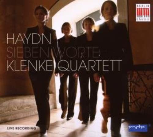 CD cover: four figures walking towards the viewer, dark tones.