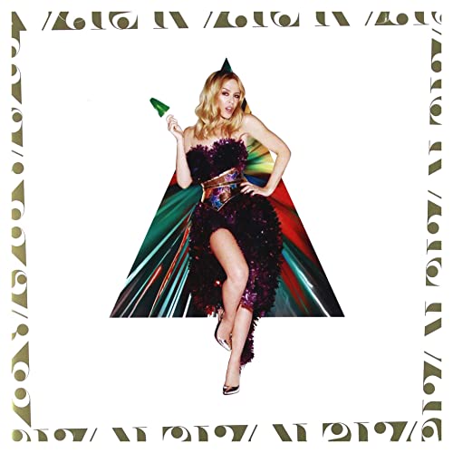 Kylie Minogue in a festive dress, holding a party favor.