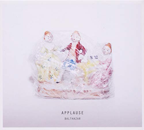 CD cover featuring porcelain figurines wrapped in plastic, text “Applause” and “Balthazar”.