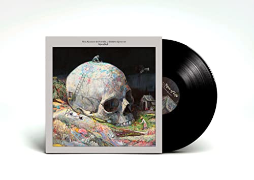 Vinyl record and cover art featuring a giant decorated skull in a landscape.