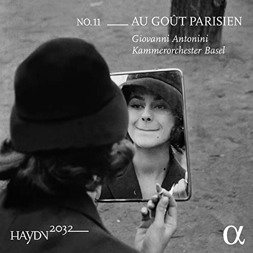 CD cover: woman looking in a hand mirror, black and white.