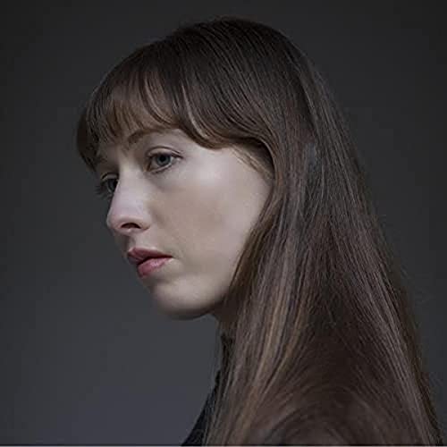 Close-up portrait of Martha Marlow, a woman with brown hair and bangs.