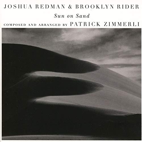 CD cover: black and white desert landscape with text overlay.
