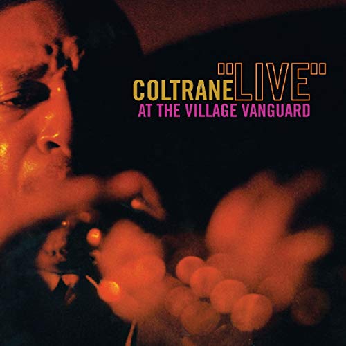 Jazz musician John Coltrane on album cover with photography and typography, CD disc included.