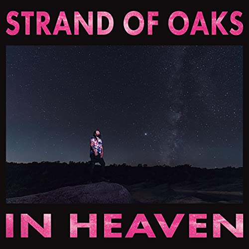 Man standing on rock under starry night sky with pink text on black background.