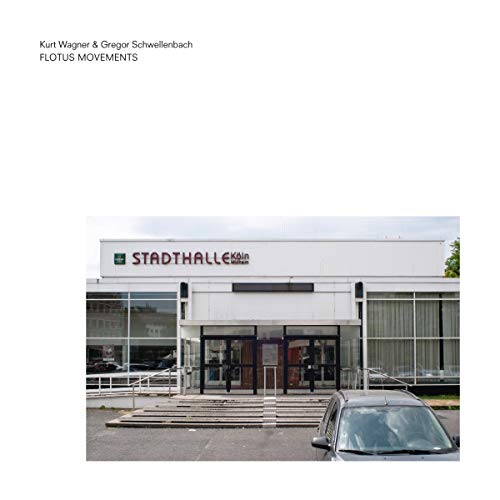 Album cover: a grey building facade with a car in foreground.