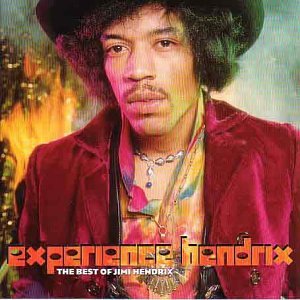 Jimi Hendrix wearing a hat and red jacket with fire in the background.