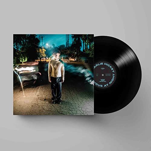 Vinyl record and album cover featuring a young man at night.