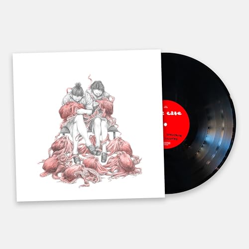Vinyl record with cover art depicting two figures and red octopus imagery.