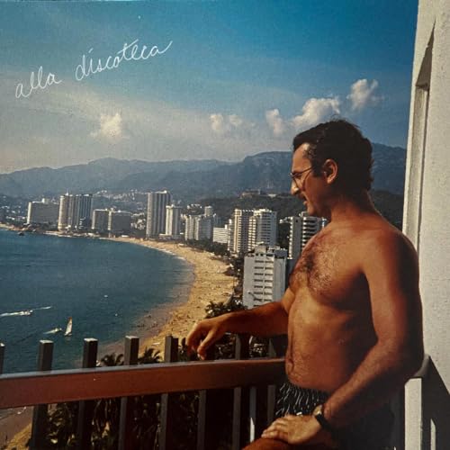 Vinyl record cover: shirtless man overlooking a coastal city and mountains.