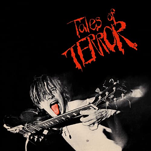 CD cover: man screaming while playing an electric guitar.