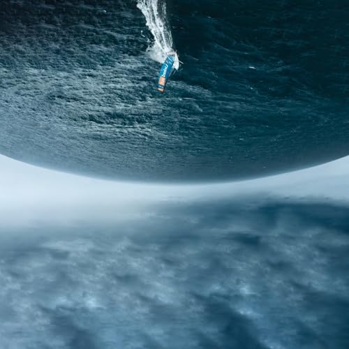 Vinyl record floating in dark blue water under a bright sky.