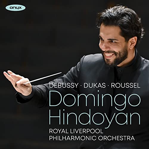 Domingo Hindoyan portrait, conductor with baton, album cover for classical music CD.