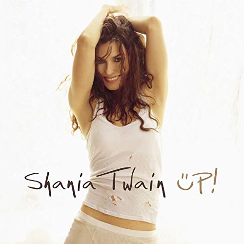 Shania Twain smiles on album cover with handwritten title "UP!".