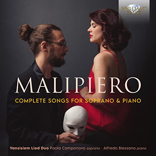 CD cover featuring a man and woman with a white mask between them.