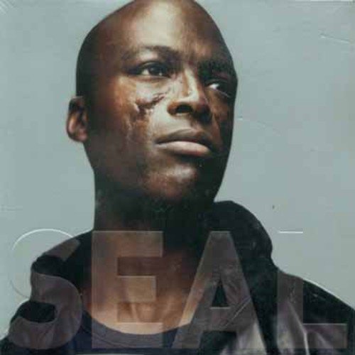 Seal album cover, close-up portrait of a man with facial scars.
