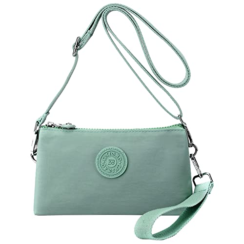 Light green nylon crossbody bag with adjustable strap and circular logo.