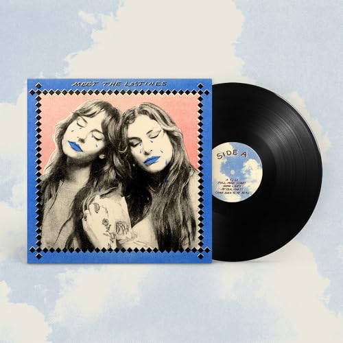 Vinyl record and album cover featuring two women with blue face paint.