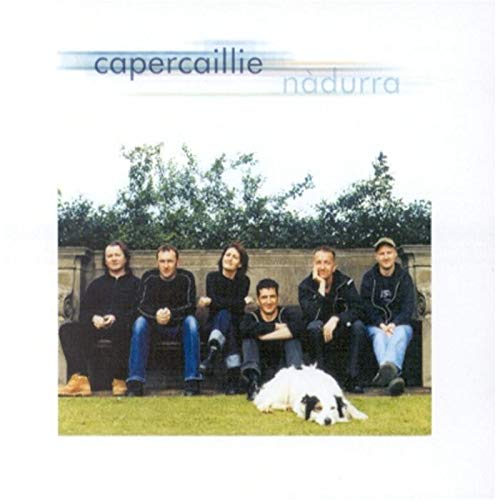 Capercaillie album cover: band members and a dog seated outdoors.