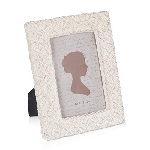 Vinyl record in a textured white frame with a silhouette image.