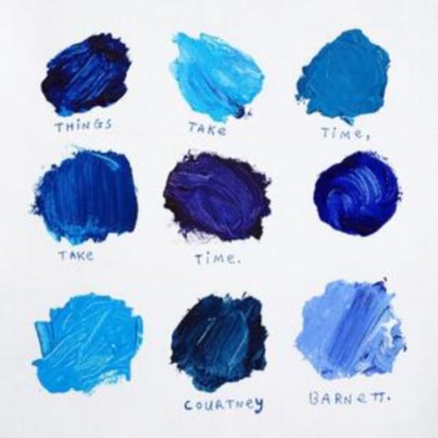 Nine blue paint swatches arranged in a grid on a white background with text.