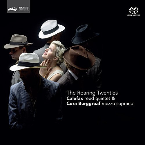 CD cover: people in 1920s attire, looking upwards, dark background.