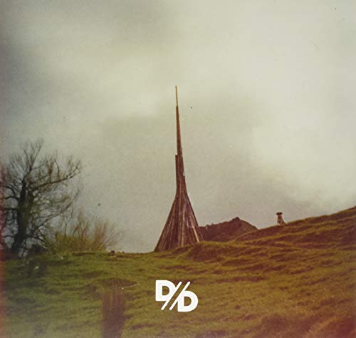 Album cover: a tall, conical wooden structure in a misty landscape.