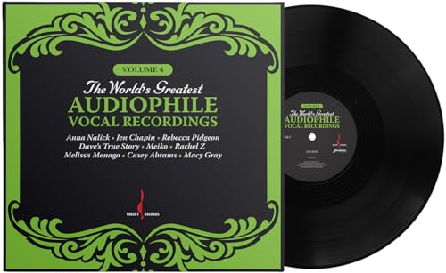 Black vinyl record and album cover with green ornate frame.