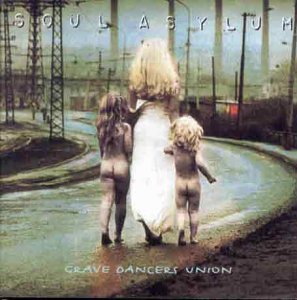 CD cover: three children walking on a road toward power lines.