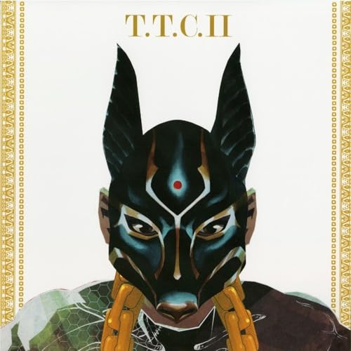 Album cover: masked figure with gold accents on a white background.