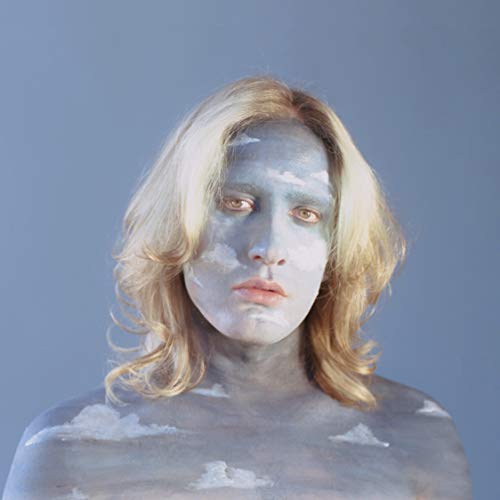 Portrait of a person with painted clouds on their face and shoulders.
