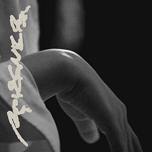 Black and white album cover featuring a partial sculpture of a torso.