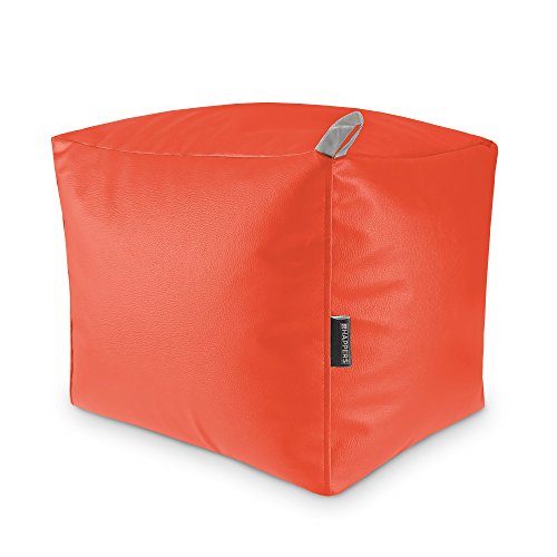 Red cube-shaped pouf with a fabric handle, isolated on white.