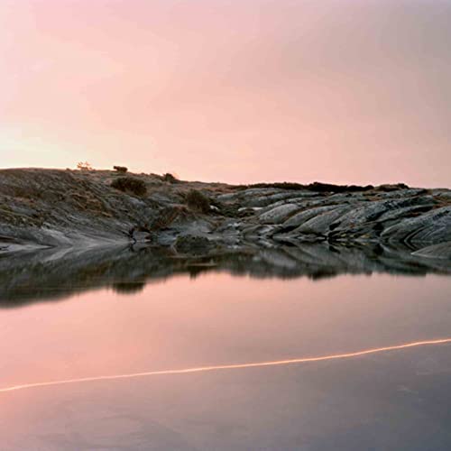 Pink and gray landscape with water reflection, album cover art.