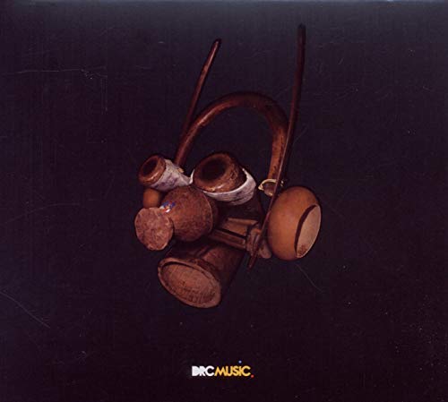 CD cover with a dark, textured background and stacked traditional drums.