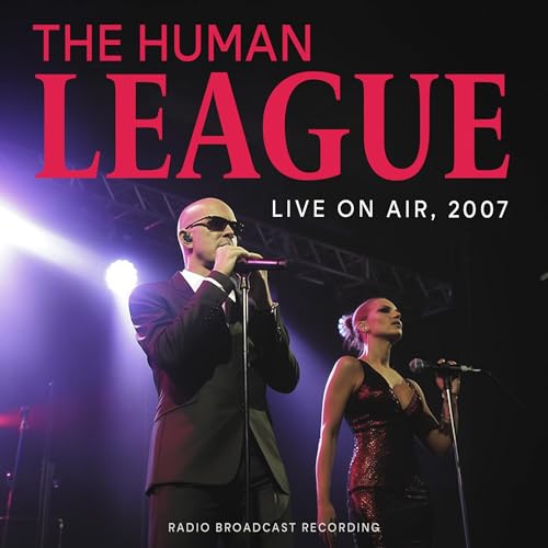 The Human League album cover featuring two singers on stage.