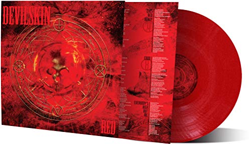 Red vinyl record with ornate, dark imagery on the album cover.