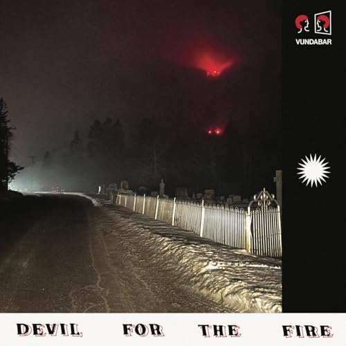 Album cover: foggy road, cemetery gate, red lights, band name Vundabar.