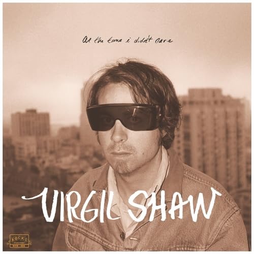 Vinyl record cover featuring Virgil Shaw wearing sunglasses, city background.