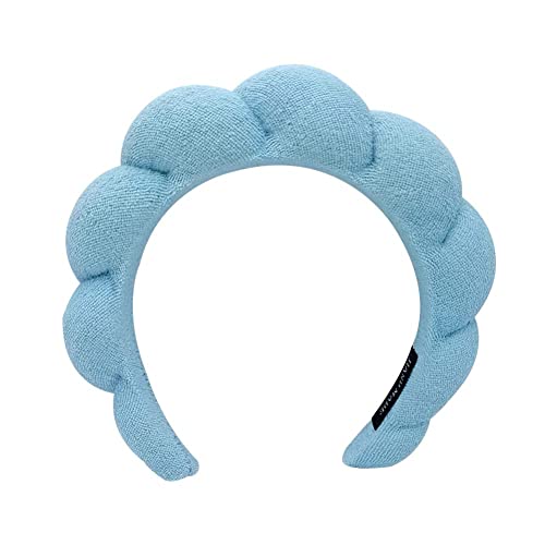 Light blue, padded headband with knotted detailing on a white background.