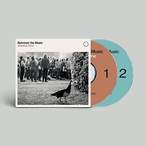 CD case with two discs, featuring a black and white crowd photo.