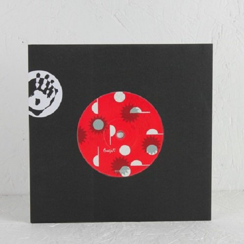 Red and black vinyl record in a black sleeve with hand graphic.