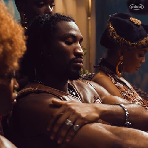 Close-up of three people with dark skin, looking thoughtfully away.