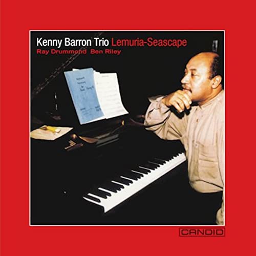 Kenny Barron Trio album cover featuring a pianist and sheet music.
