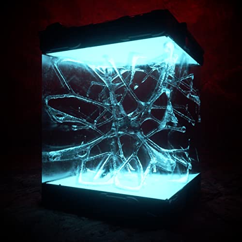 Blue glowing cube containing a complex, web-like structure inside.