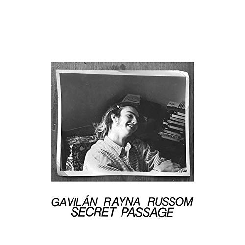 Black and white photo of Rayna Russom at a keyboard, album title below.