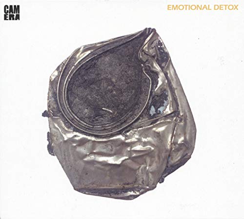 Crushed silver can with a dark center, album cover for Camera’s “Emotional Detox”.