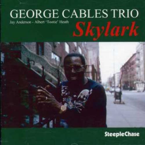 CD cover featuring jazz pianist George Cables and a city street.