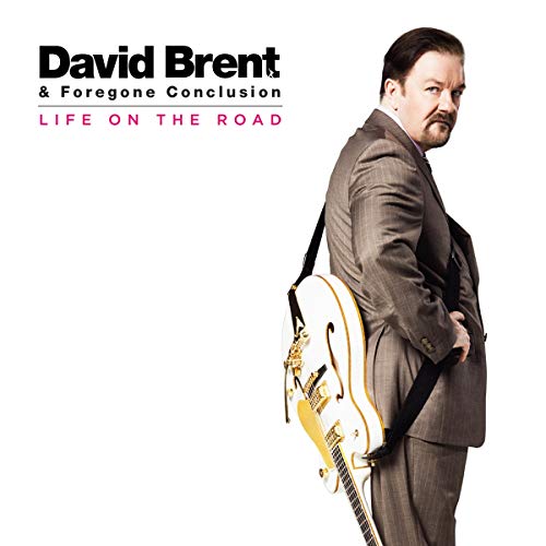 David Brent in a suit with a guitar, album cover art.