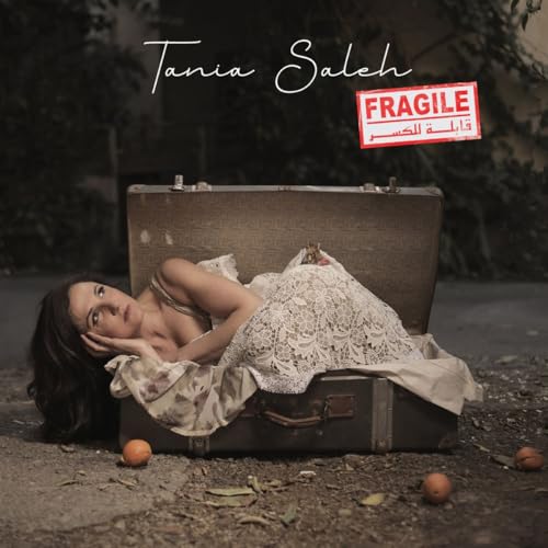 CD cover for Tania Saleh’s “Fragile” featuring a woman in a suitcase.